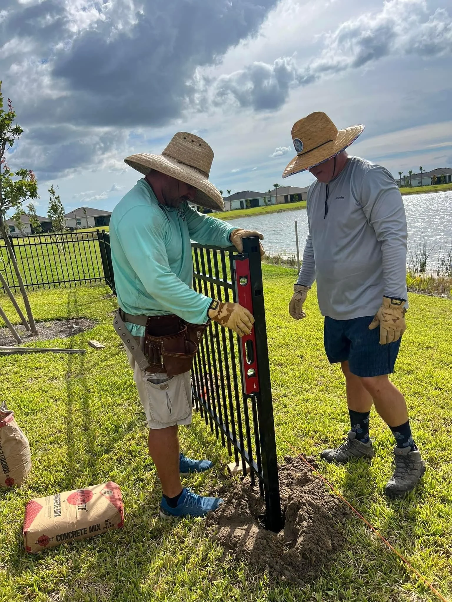Southern Hoss team carefully installing an aluminum fence